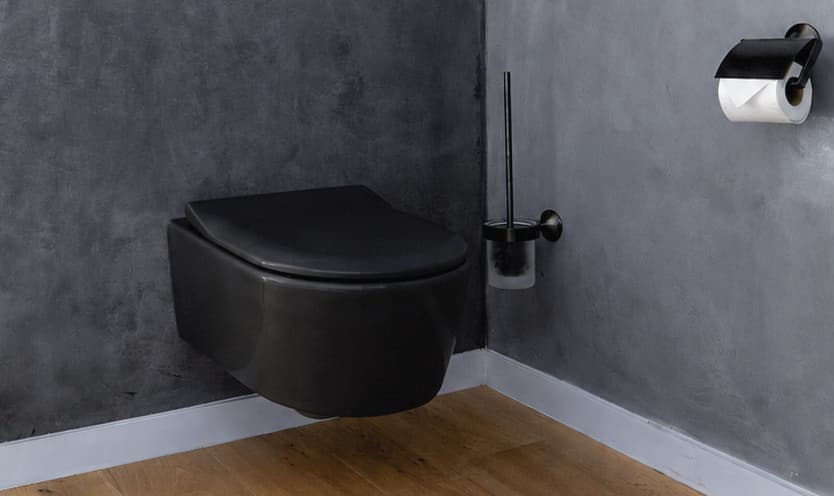 Modern bathroom with matt black wall-hung toilet and black accessories